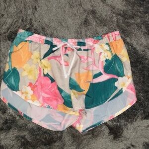 Nike Floral Athletic Shorts in Pink, Teal, Yellow